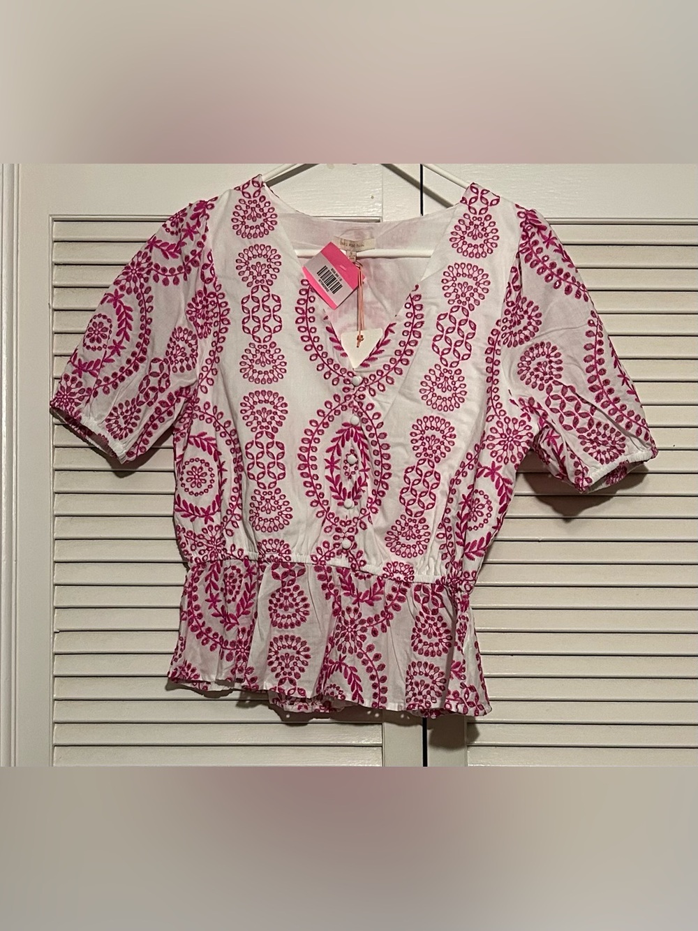 Skies Are Blue White Peplum Blouse with Pink Embroidered Motif